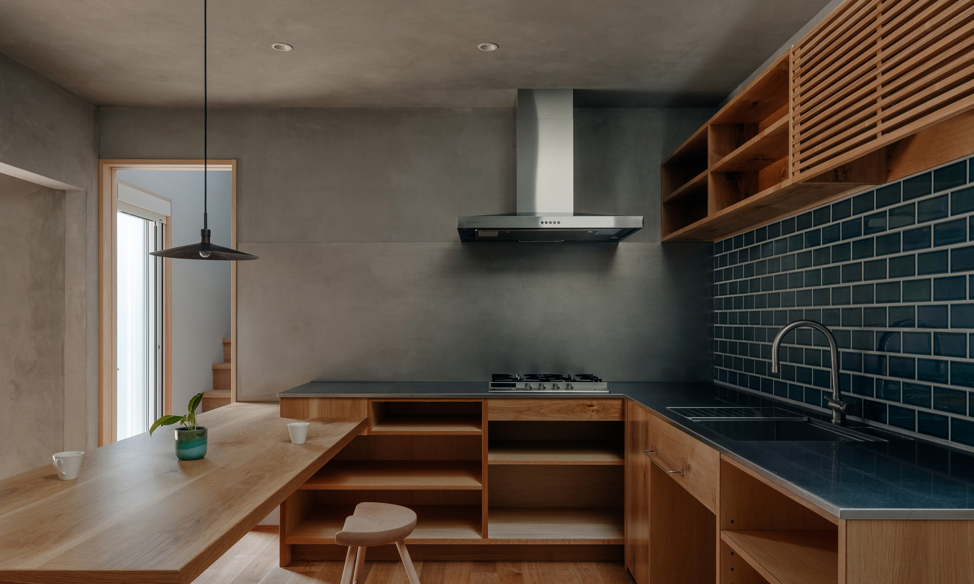Green kitchen back splash by Hearth Architects