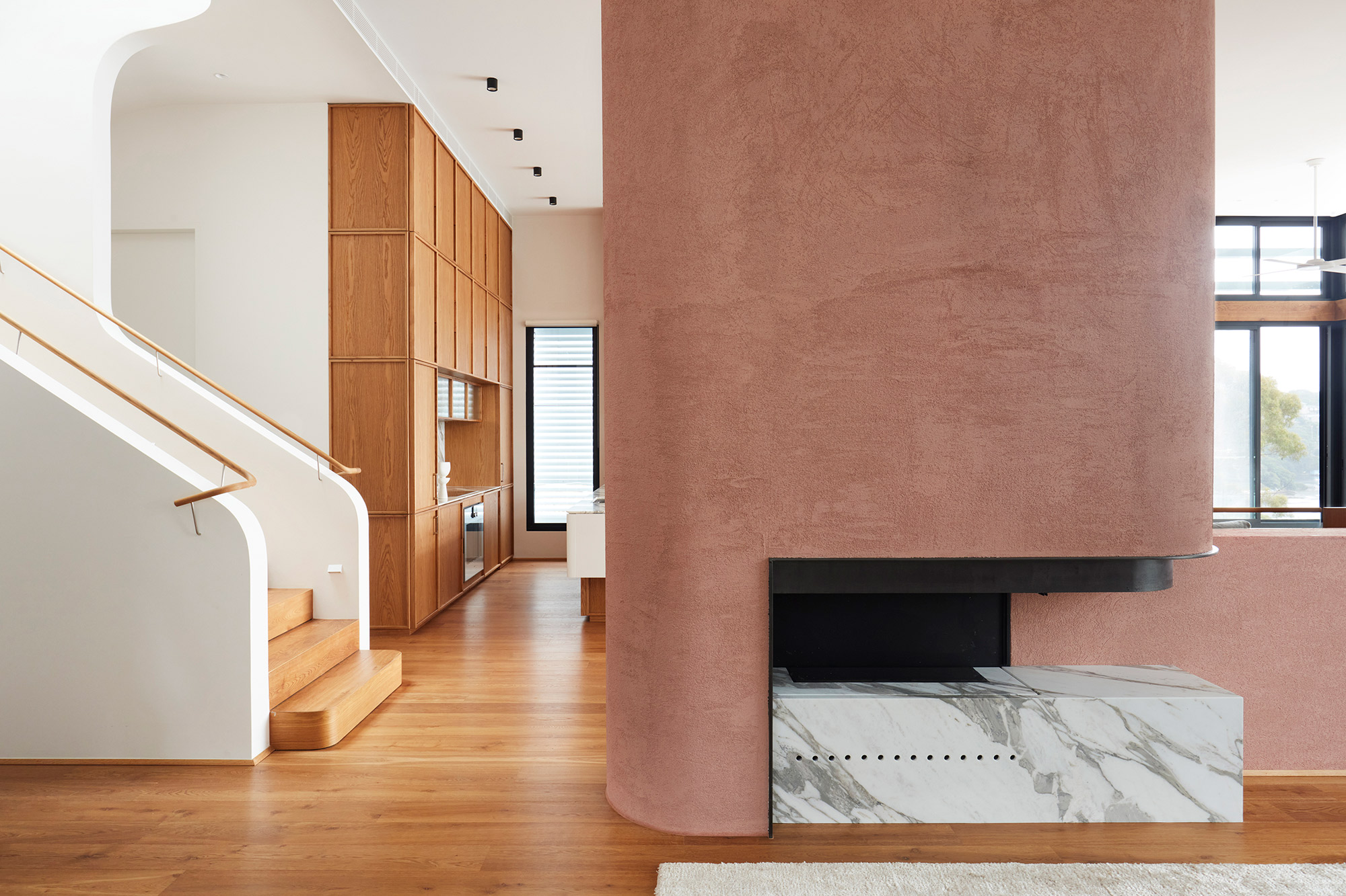 Earth-Ship house by Luigi Rosselli, marble fireplace