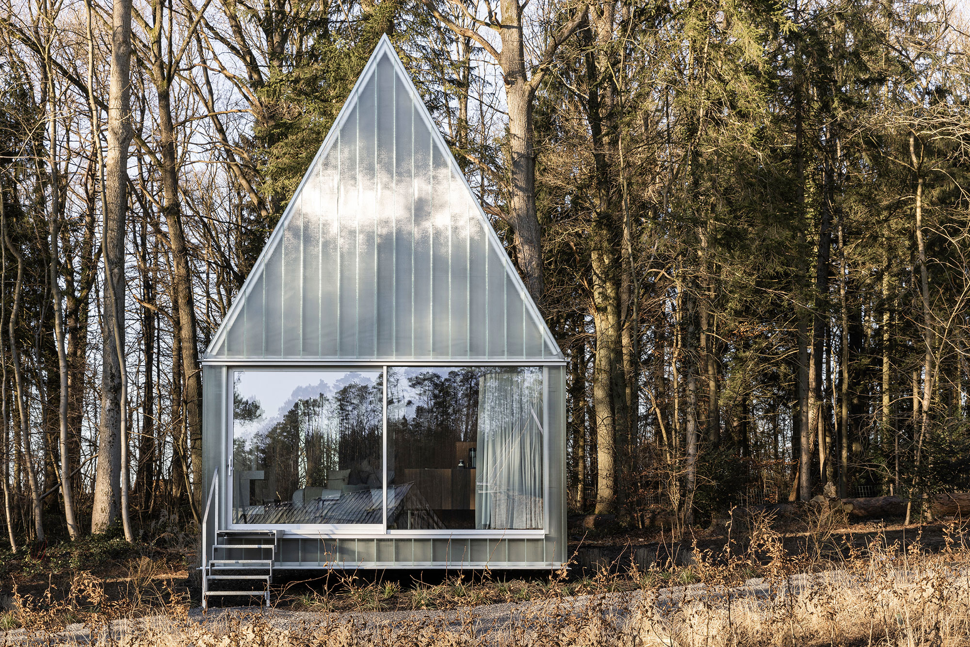 A frame cabin made of glass