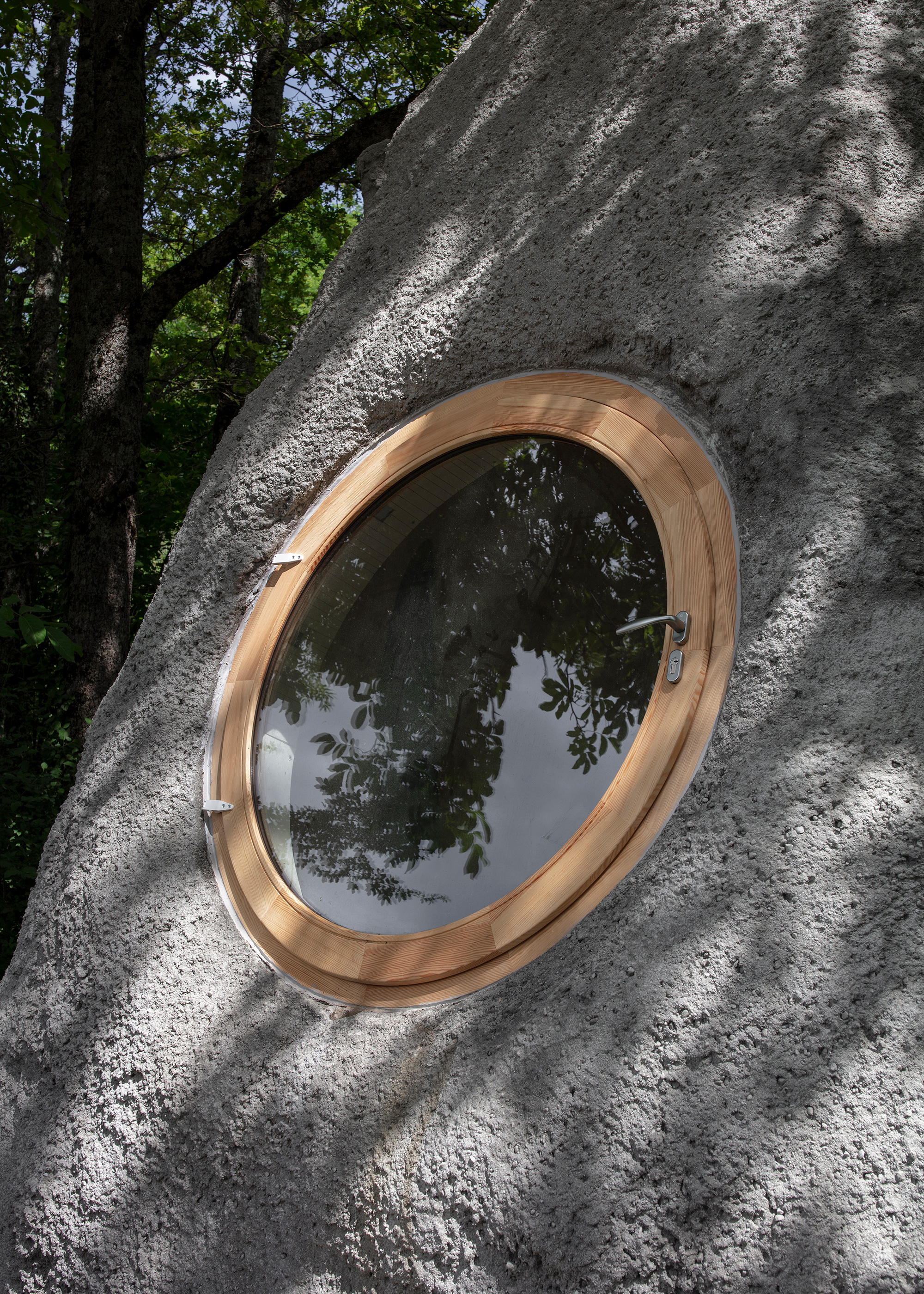 Round window in a tiny cabin