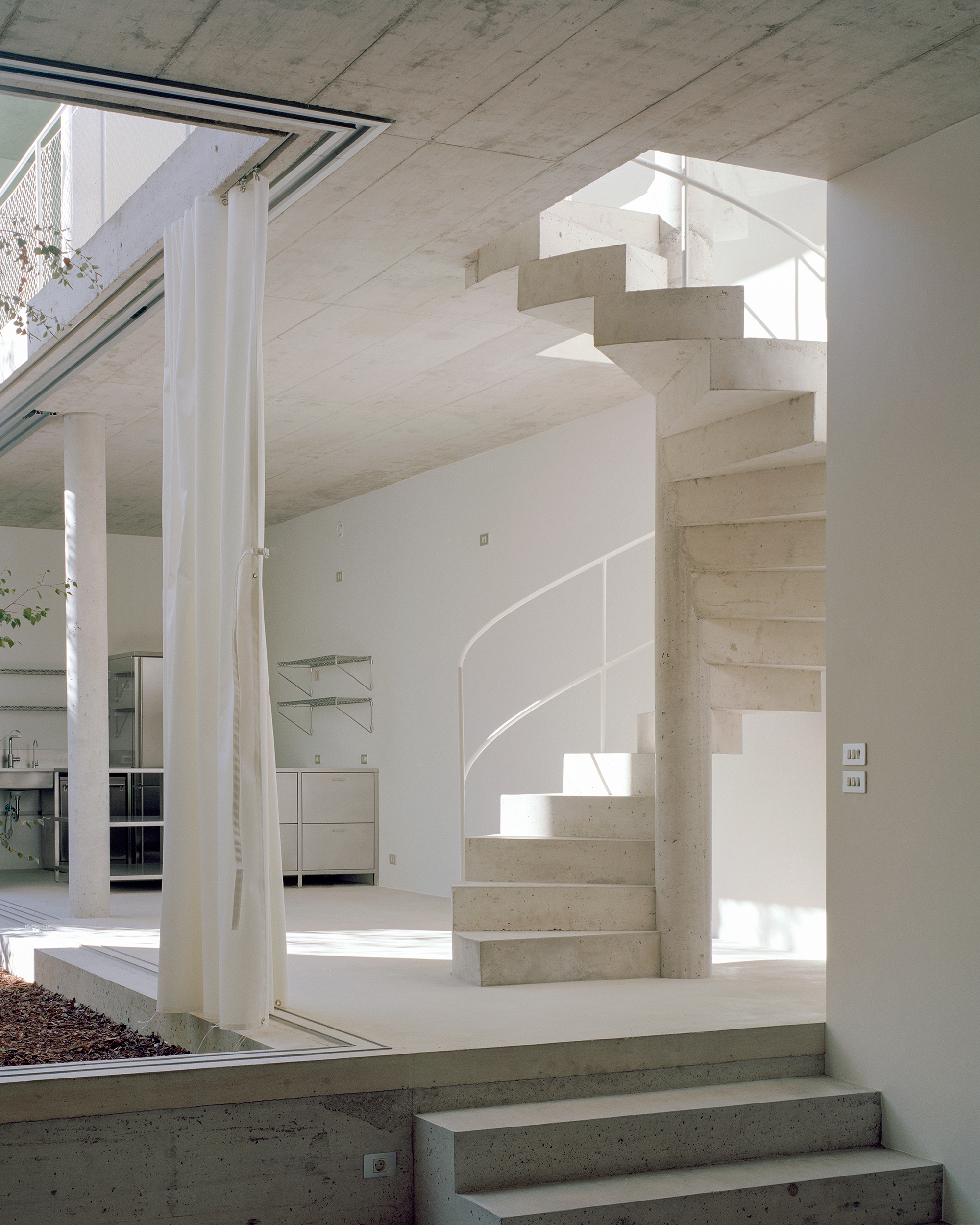 concrete spiral staircase, minimalist interior
