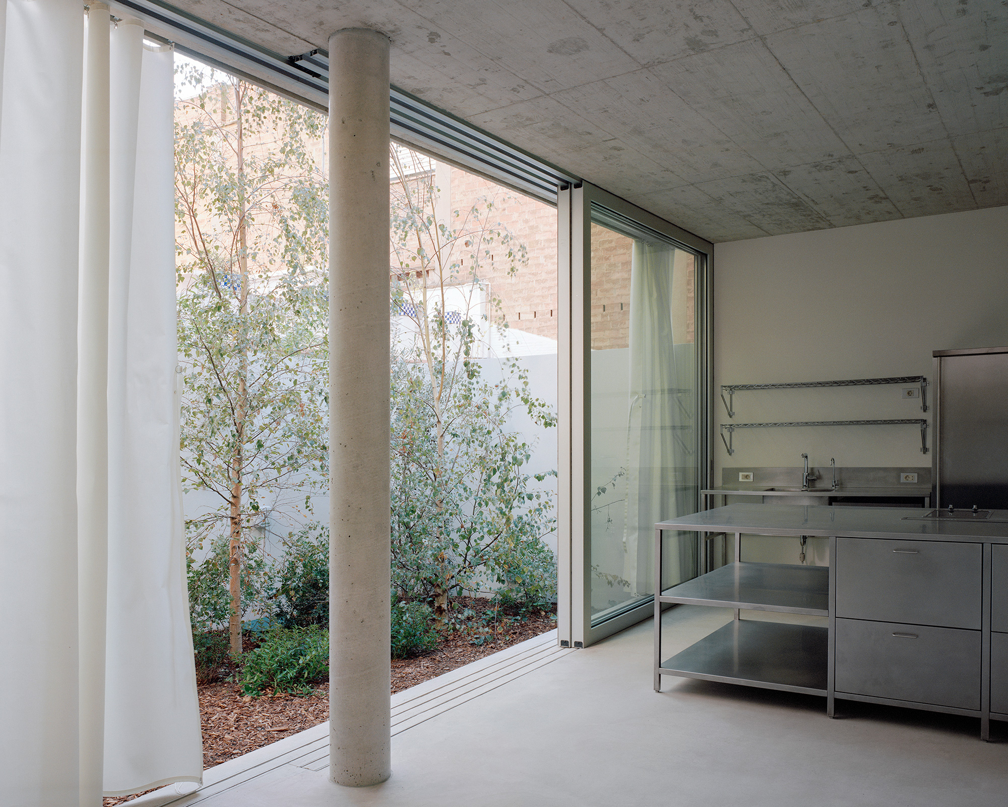 White minimalist interior with concrete floors