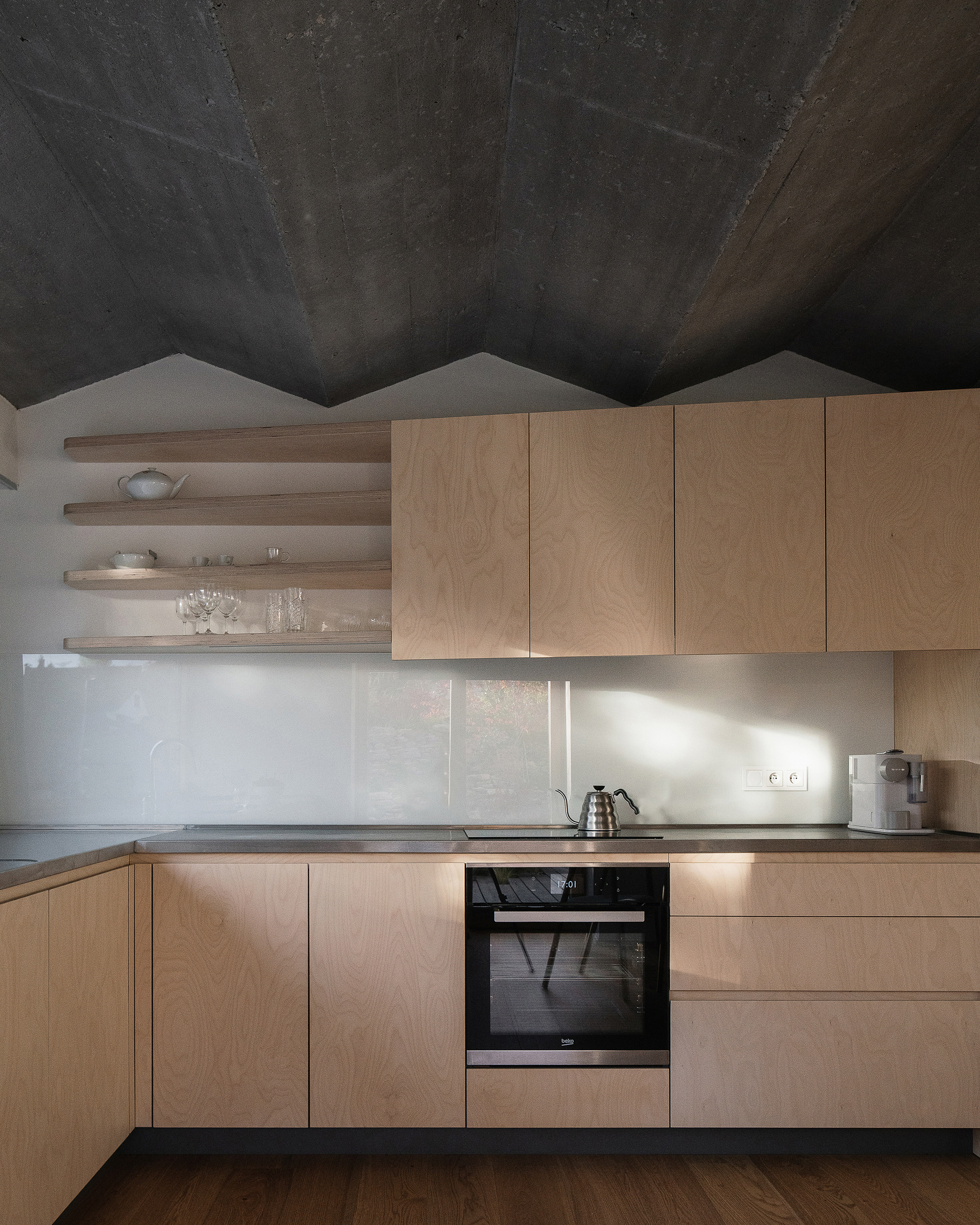 House in Zbraslav by Martin Neruda Architektura, kitchen with zig zag ceiling